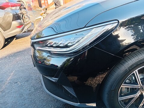 Close-up of Modern Black Car Headlight with LED Technology
