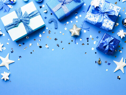 Festive Blue Holiday Gifts with Stars and Glittering Decorations