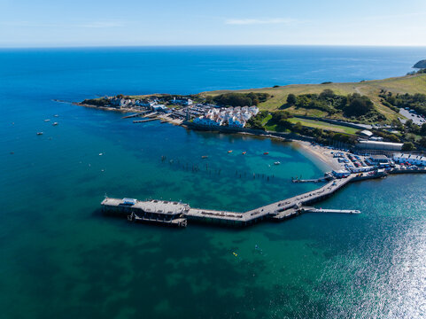 Aerial shot of swanage pier and peveril point on a calm sunny day, Dorset, UK