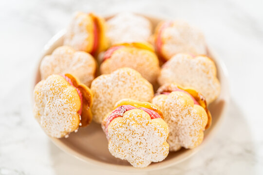 Lemon Spritz Cookie Sandwich with Cranberry Buttercream