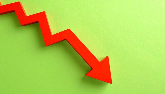 Red arrow pointing down on a vibrant green background, symbolizing financial decline and loss