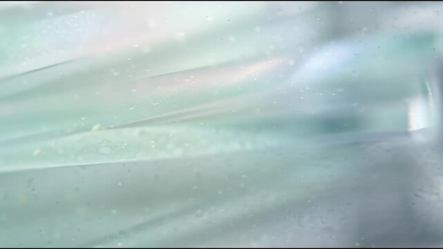 Frosted medical glass panels create a sterile MedTech background, featuring translucent opalescent