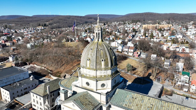 Aerial view of the Cathedral of the Blessed Sacrament with its prominent dome surrounded by residential neighborhoods and urban landscape in Altoona, Pennsylvania, United States.