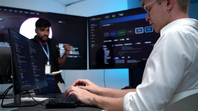 Coder typing code in sleek tech workspace