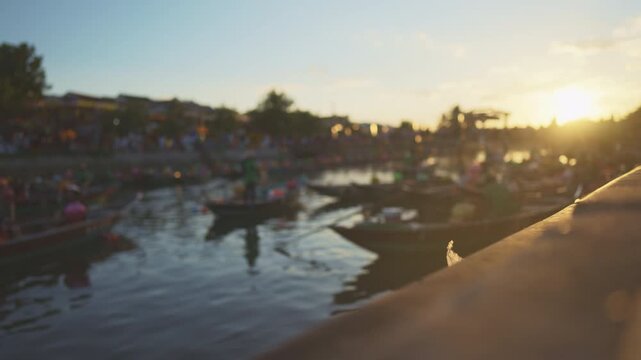 People riding pleasure boats on river in sunset time, beautiful view and relax. Tourist attraction and entertainment, river cruise in Vietnam city hoi an, traveling and tourism in summer holidays