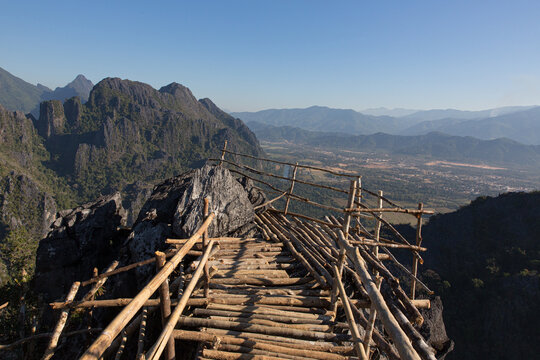 Bamboo viewpoint on mountain peak overlooking valley in Laos