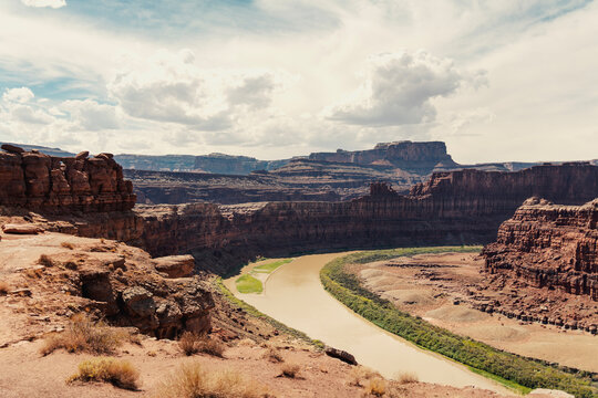 Sweeping view of a river bending through a desert canyon