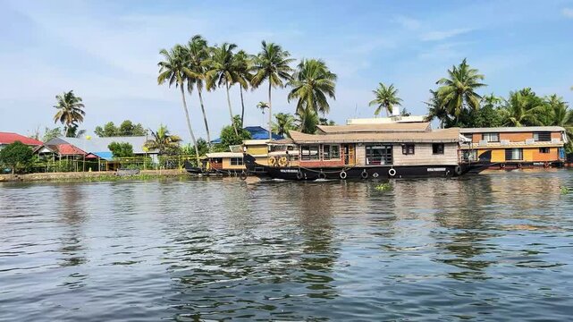 Wide Angle View of Traditional Wooden Houseboat Sailing on Kerala Backwater in South India.