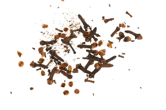 Dry clove buds falling creating a spice background