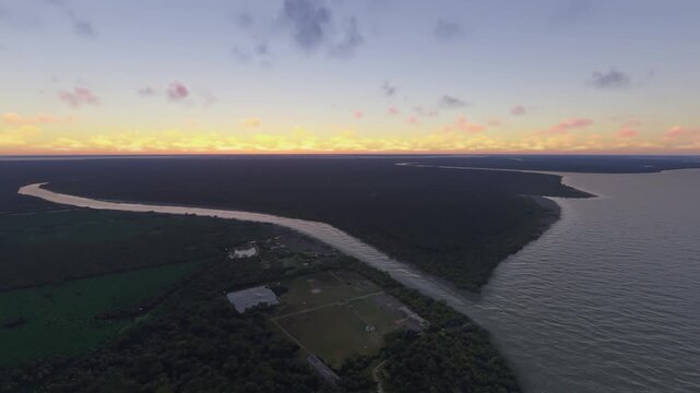Circular aerial drone shot at sunset of Hiron Point in Khulna. Bangladesh