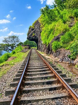    Beautiful railway track through the Lion's Mouth rock tunnel in Kadugannawa, Sri Lanka.