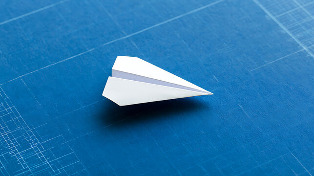 White paper airplane levitate above blue architectural blueprint background, concept of business strategy, innovation, and startup vision