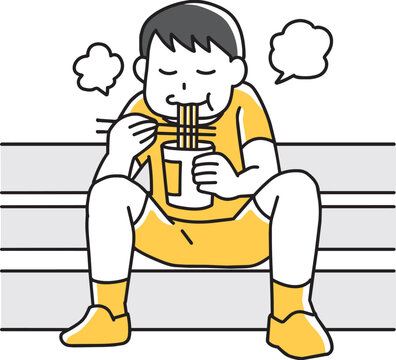 階段に座ってカップラーメンを食べる男の子