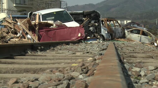 Wrecked Vehicles Block Railway Line In Aftermath Of Tsunami In Japan