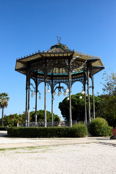 Catania, Italy; 1st September 2026: Scenic view of Parco Maestranze in Catania with lush Mediterranean trees and historic architecture