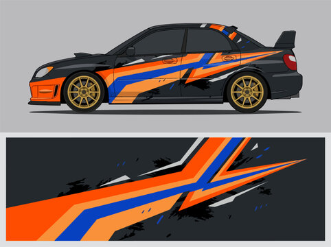 Black rally car with orange and blue racing decals.