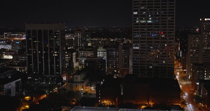 Columbus Ohio Aerial v42 establishing shot, ow tracking flyover arena district capturing illuminated downtown cityscape and urban streets at night - Shot with Inspire 3 8k - Sept 21st 2023