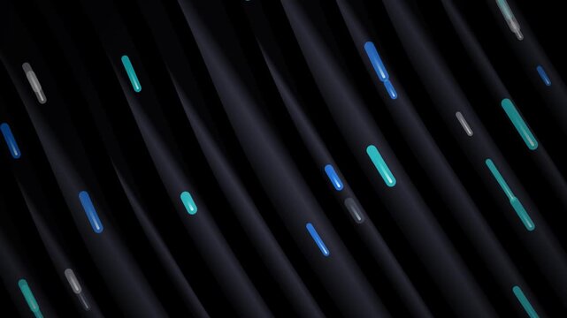 Abstract blue and green light streaks moving across dark ribbed surface with bokeh