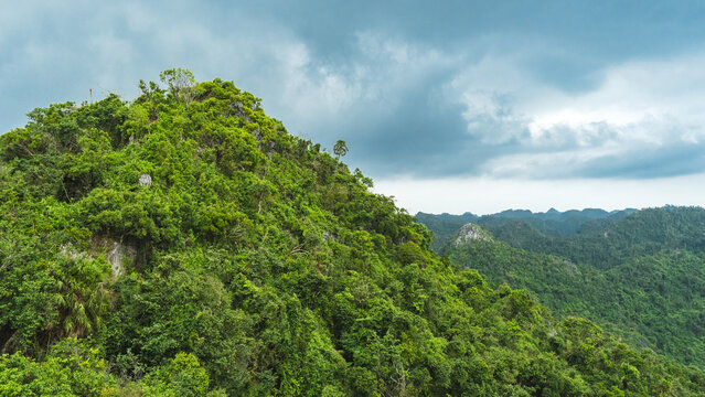Lush Tropical Karst Mountains Under Dramatic Clouds in Tam Coc, Vietnam