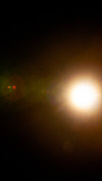Sun flare on the black background