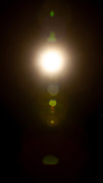 Sun flare on the black background