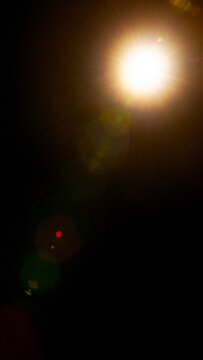 Sun flare on the black background