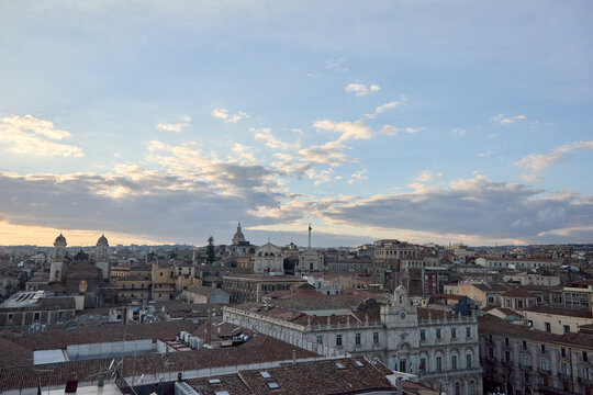 Aerial view of Piazza del Duomo in Catania at sunset with historic architecture and city life