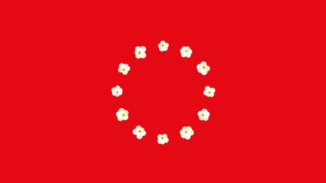 Popcorn kernels forming circles on a vibrant red background