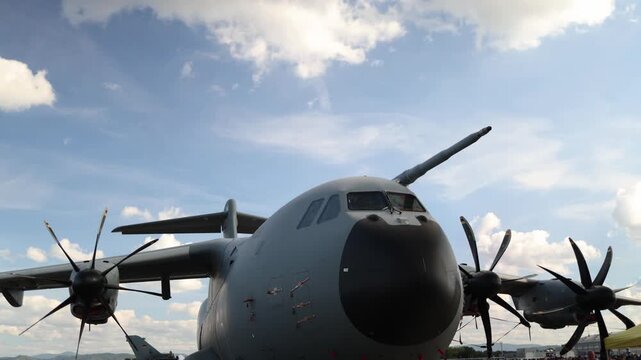 Airbus A400M military transport aircraft parked on an airfield with four turboprop engines showing massive cargo plane design and modern strategic airlift capability worldwide