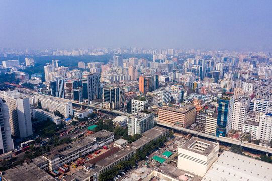 Aerial view of dense urban cityscape with modern high-rise buildings, busy roads, and infrastructure in the capital city of Dhaka, Dhaka Division, Bangladesh.