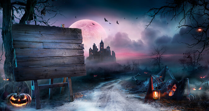 Halloween Billboard And Zombie In Spooky Landscape At Moonlight With Full Moon