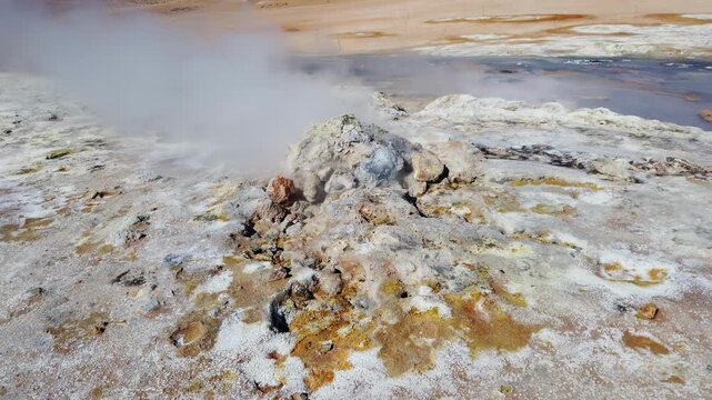 Hverir geothermal area below Namafjall near Lake Myvatn, Iceland, a steaming fumarole mound crusted with yellow sulphur deposits.