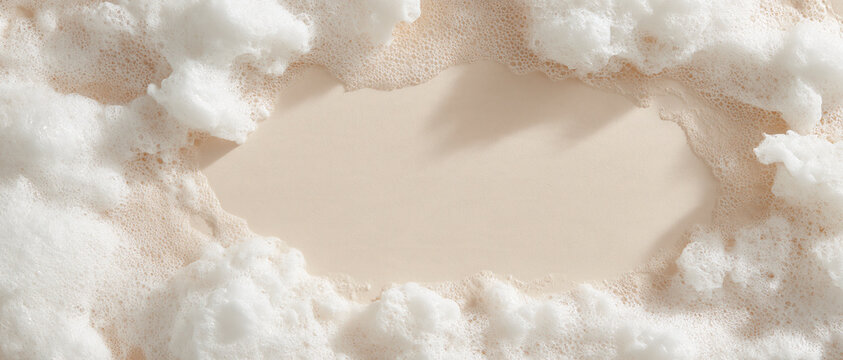 Luxurious white foam and delicate bubbles creating a clean, inviting frame on a light beige background, perfect for beauty product showcases, spa themes, or hygiene advertisements with