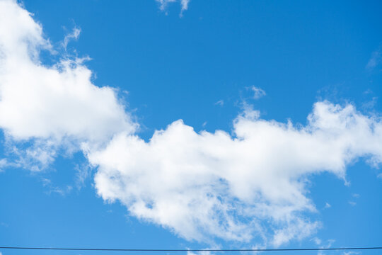 Bright Blue Sky with Fluffy White Clouds