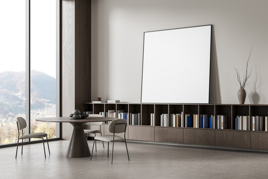 Modern minimalist dining room interior design with empty wall poster mockup, built-in shelving, books, table, chairs, and scenic window view. 3D Rendering