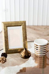 Golden photo frame on a table © Rawpixel.com