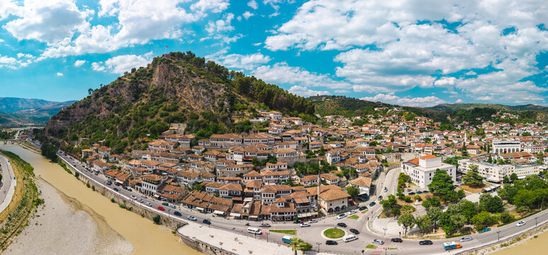 Aerial Panorama of Berat with Hillside Homes and Shallow River
