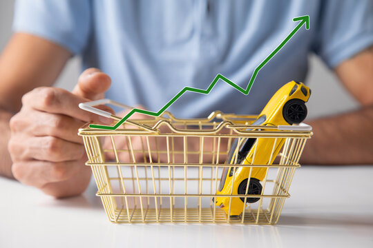 Man showing shopping cart, toy car and rising arrow.