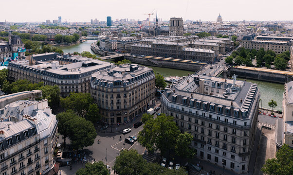 Paris, France - Wide view of the Seine and urban architecture under a bright sky