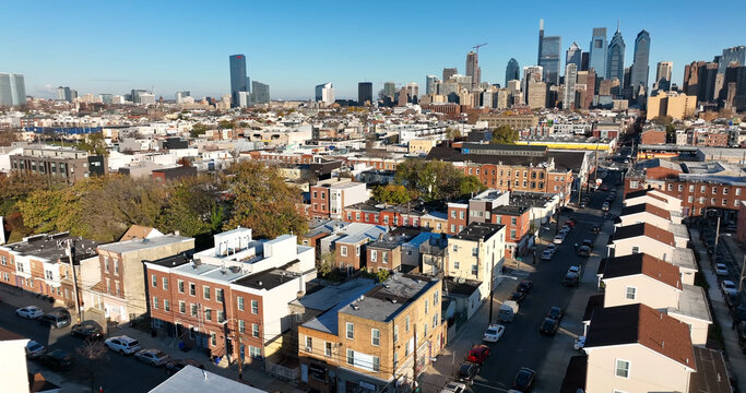 Aerial view of the West Philadelphia residential neighborhood with row houses, leading towards the downtown Philadelphia skyline. Philadelphia, Pennsylvania, United States.