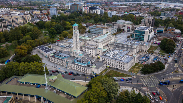 Aerial view of Southampton Civic Centre with its iconic clock tower, surrounded by urban streets, green spaces, and modern architecture in Southampton, England, United Kingdom.