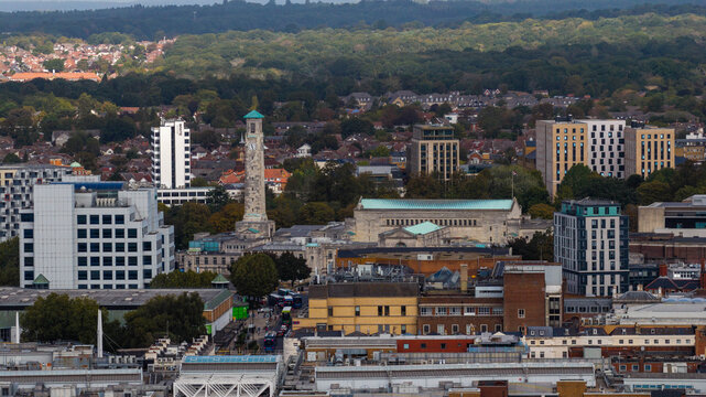 Aerial view of the Southampton Civic Centre Clock Tower surrounded by urban architecture, historic buildings, and lush green trees in Southampton, England, United Kingdom.