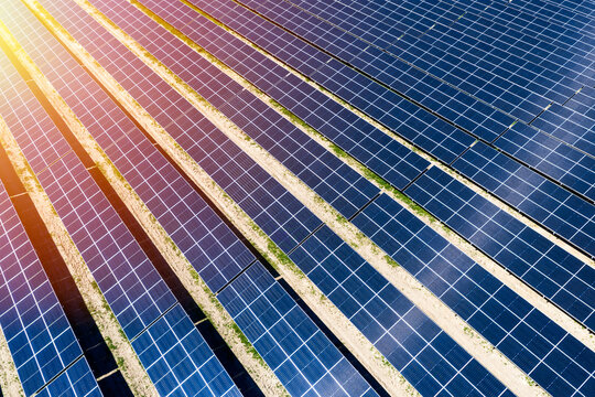 Aerial view of solar panels arranged in rows at a solar farm in Prague, Prague, Czechia.