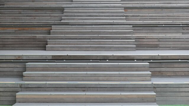 Wooden tiered seating and stairs with repeating geometric pattern