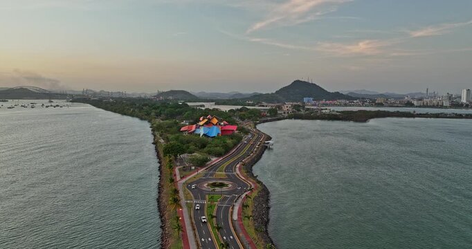 Panama City Aerial v54 low level flyover amador causeway capturing vivid architecture museum with downtown cityscape and ancon hill in the background - Shot with Mavic 3 Cine - March 2022