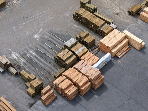 Aerial view of stacks of timber and lumber stored in an industrial yard in Melbourne, VIC, Australia.