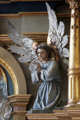 Obraz premium Angel, statue on the main altar in the parish church of the Sacred Heart of Jesus in Velika Pisanica, Croatia
