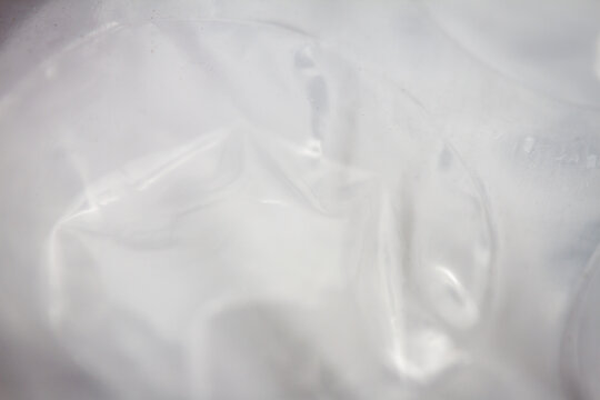 Extreme macro of plastic bubble wrap texture. Selective soft focus, shallow depth of field. Abstract dreamy background