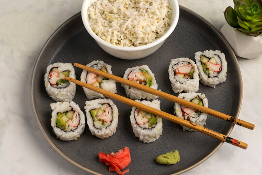 california rolls served with a side pf rice
