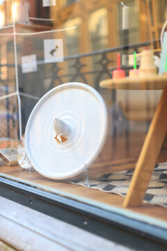 Dreamy, fine art image with mirror reflection of a shop window filled with all sorts of colorful interior products